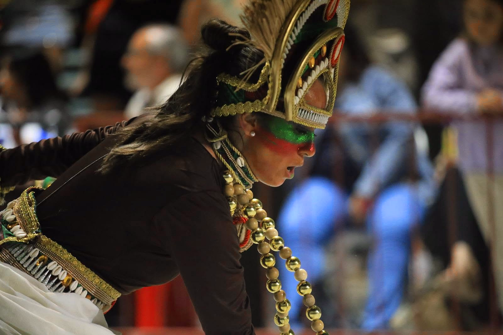 Barrio Rampla member with gold headdress and mask