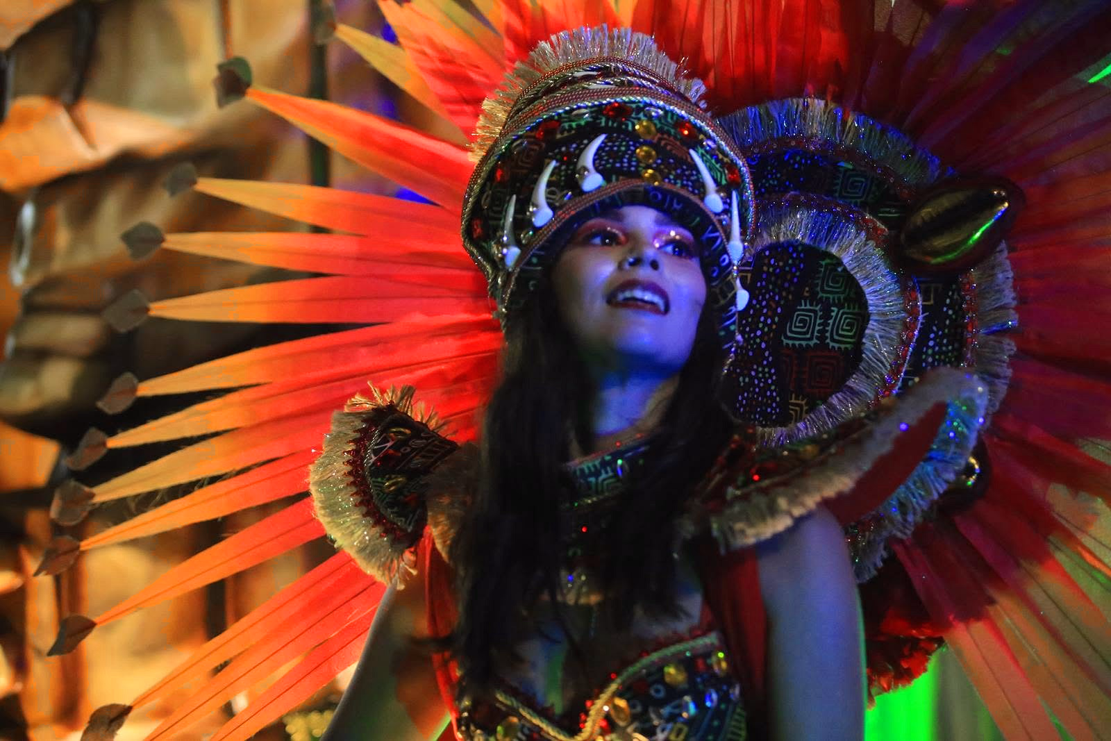 Barrio Rampla featured dancer with a red feather headdress