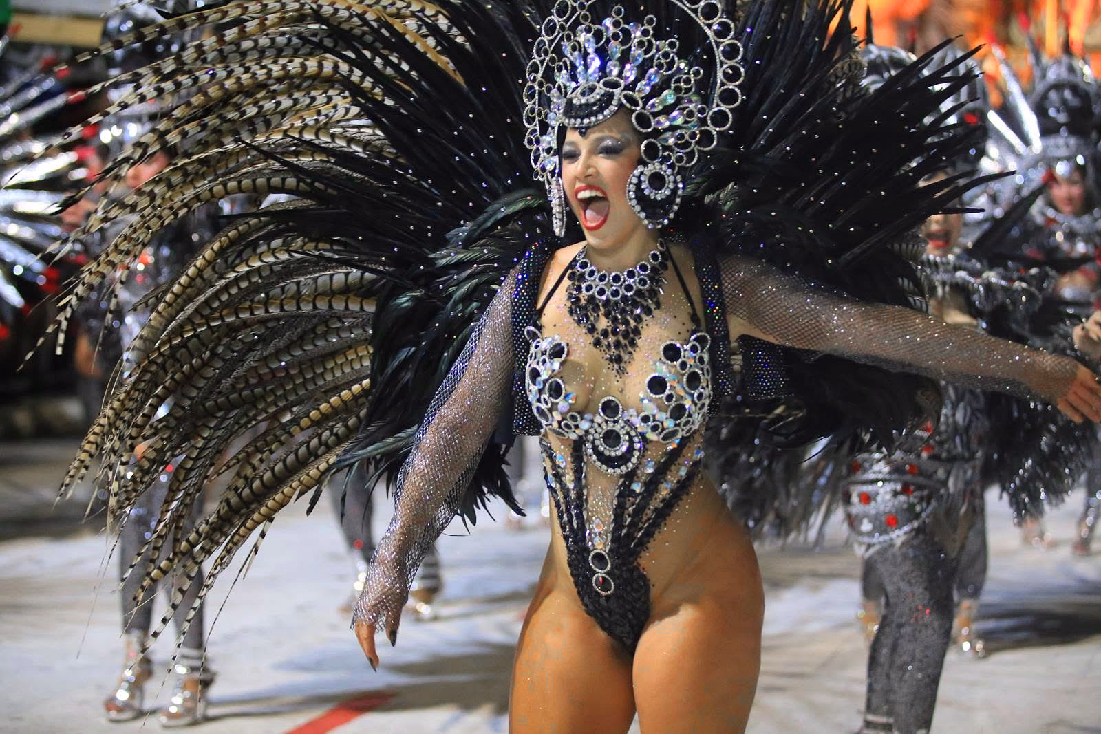 Barrio Rampla featured dancer with black and sky-blue feathers