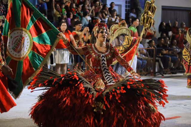 Barrio Rampla featured dancer beside the school flag