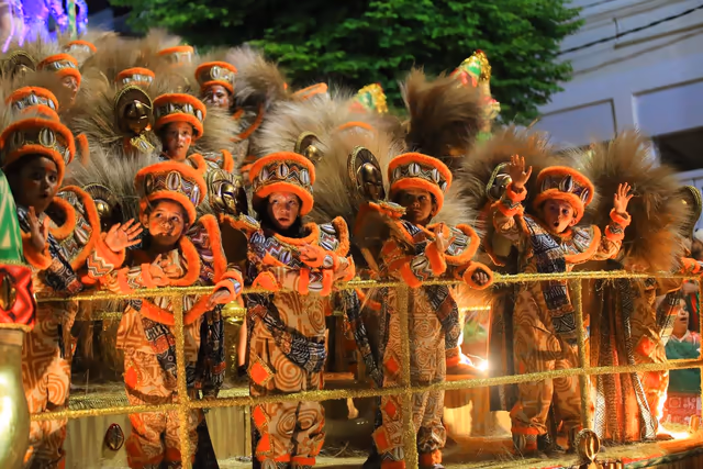 Barrio Rampla wing in orange costumes and feathers