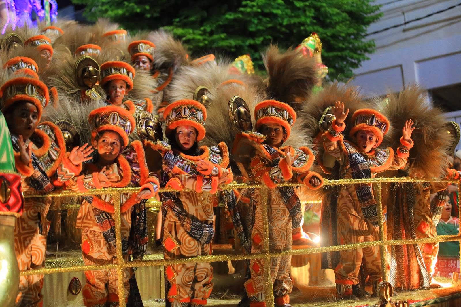 Barrio Rampla wing in orange costumes and feathers