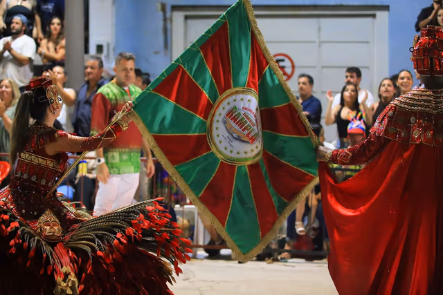 Barrio Rampla member with flag and red cape