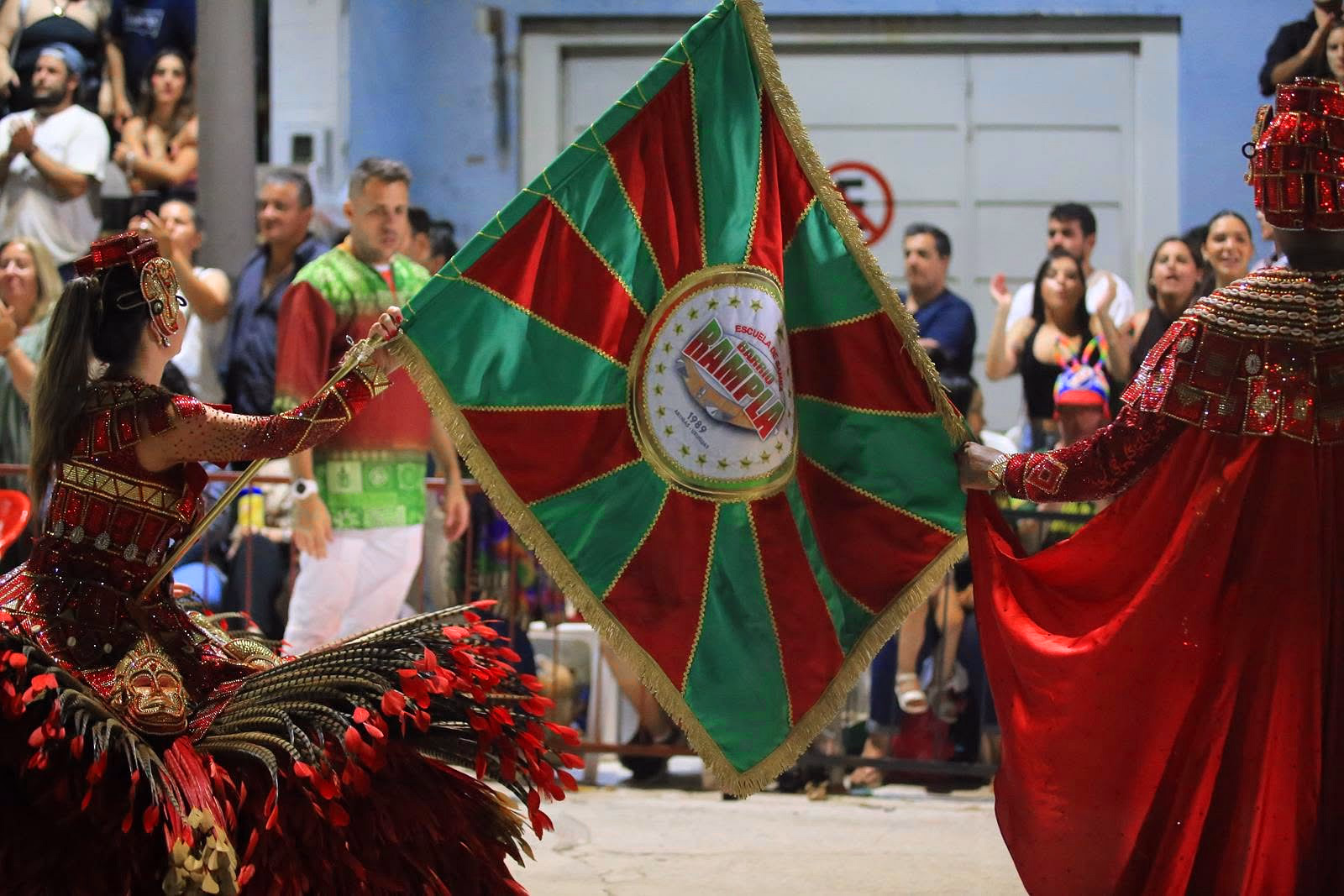 Barrio Rampla member with flag and red cape