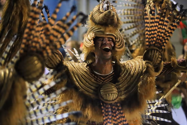 Barrio Rampla member with gold headdress and plaid shirt