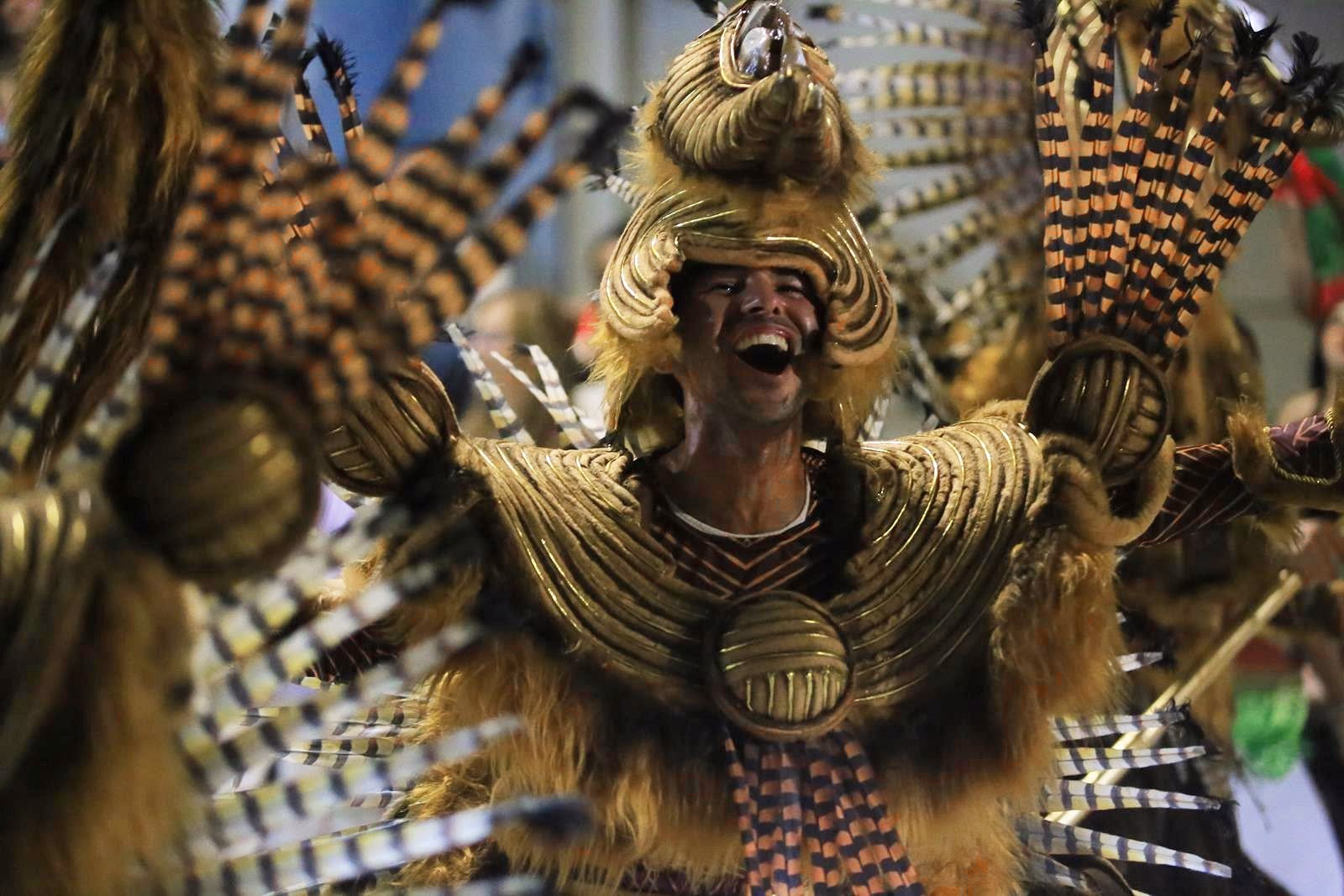 Barrio Rampla member with gold headdress and plaid shirt