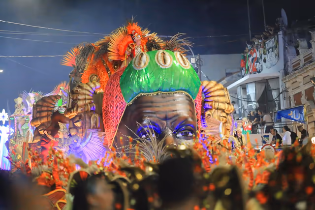 Barrio Rampla float with a lit green dragon head