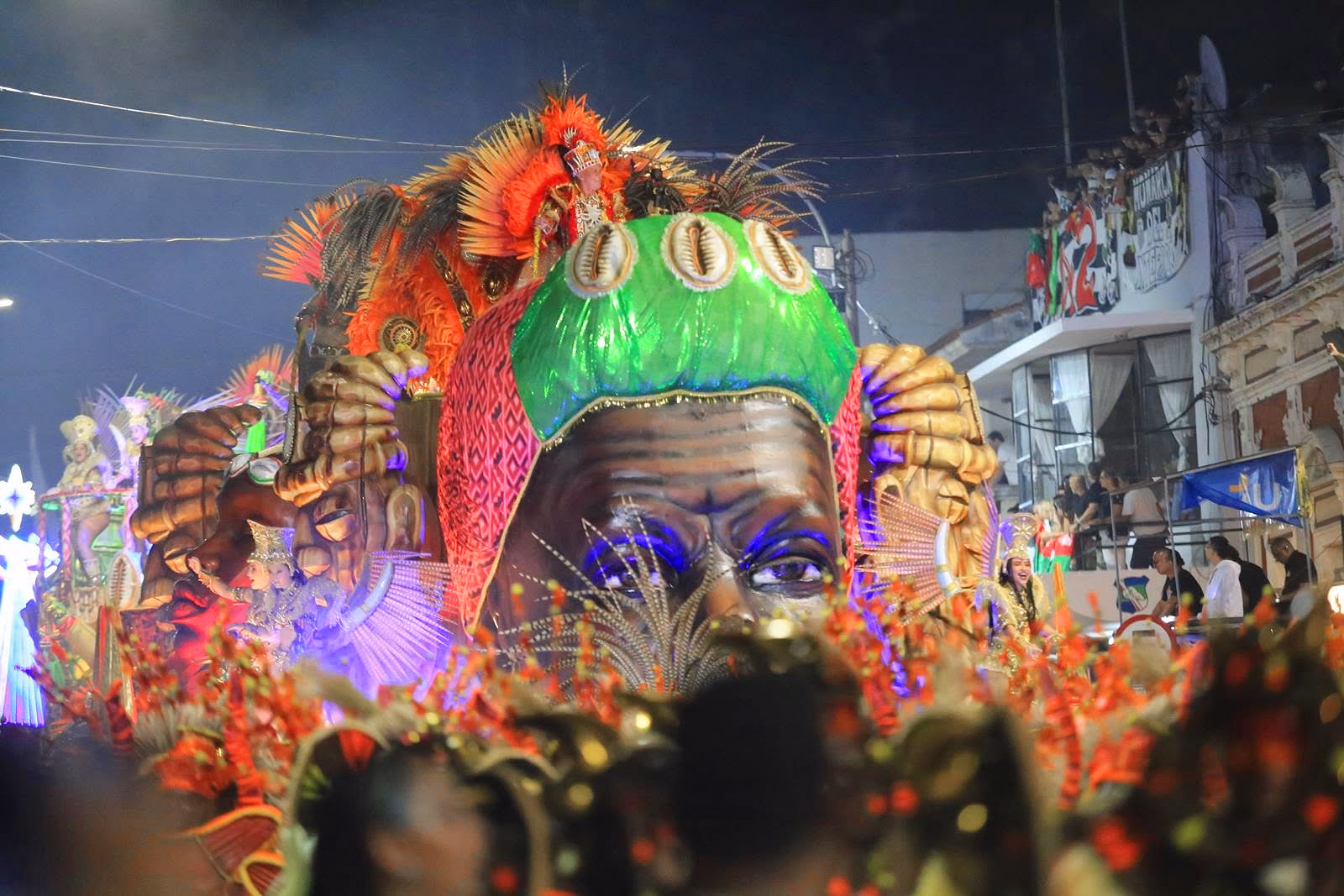 Barrio Rampla float with a lit green dragon head