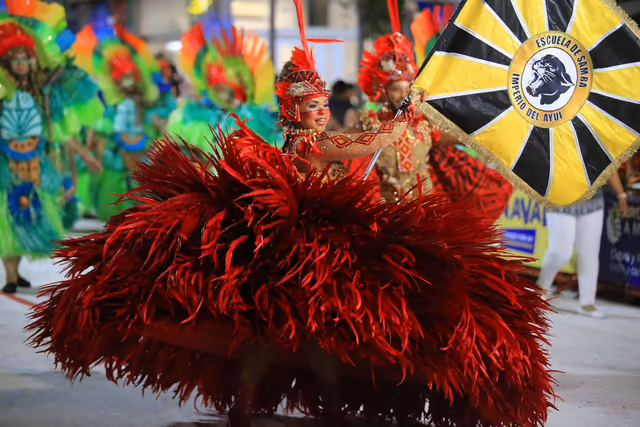 Imperio del Ayuí featured dancer with the school flag