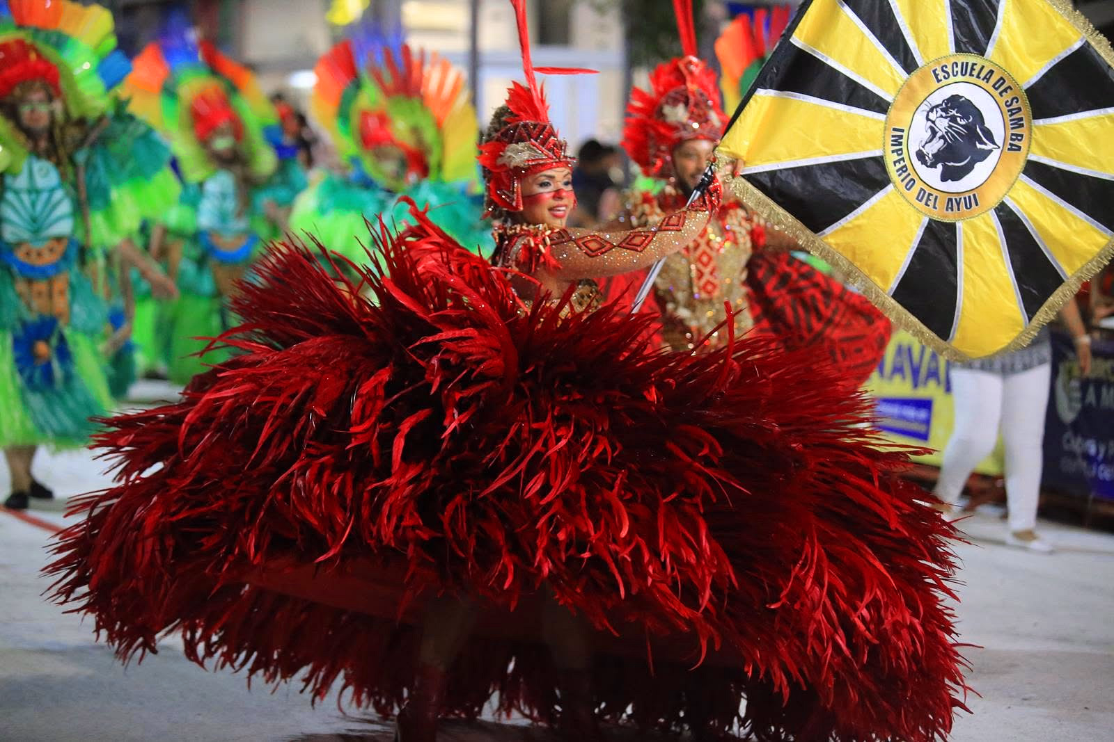 Imperio del Ayuí featured dancer with the school flag